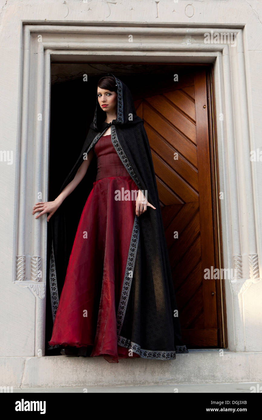 black dress red cape Black dress embroidered with red and with a side cape