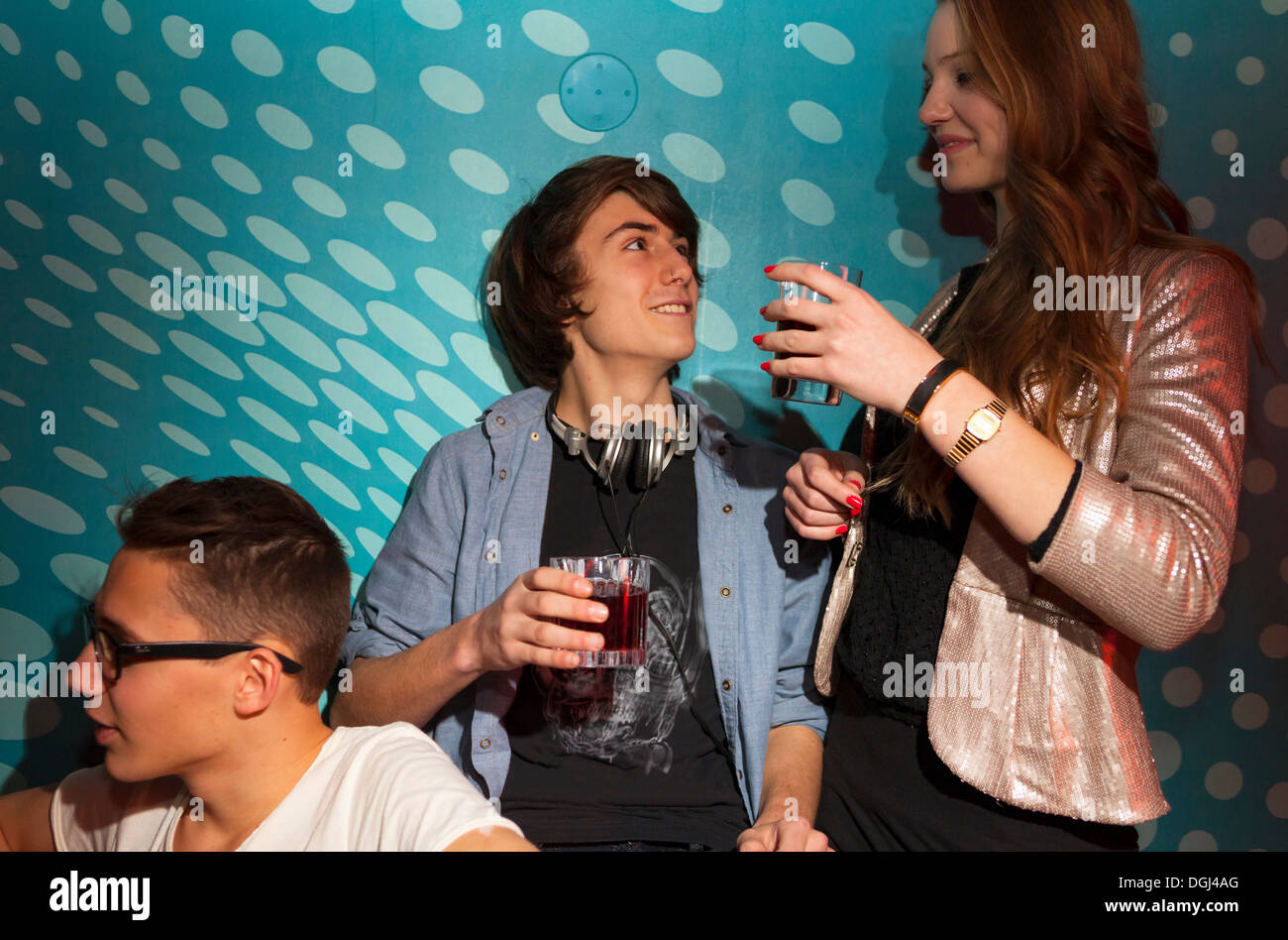 Teenagers holding drinking glasses Stock Photo