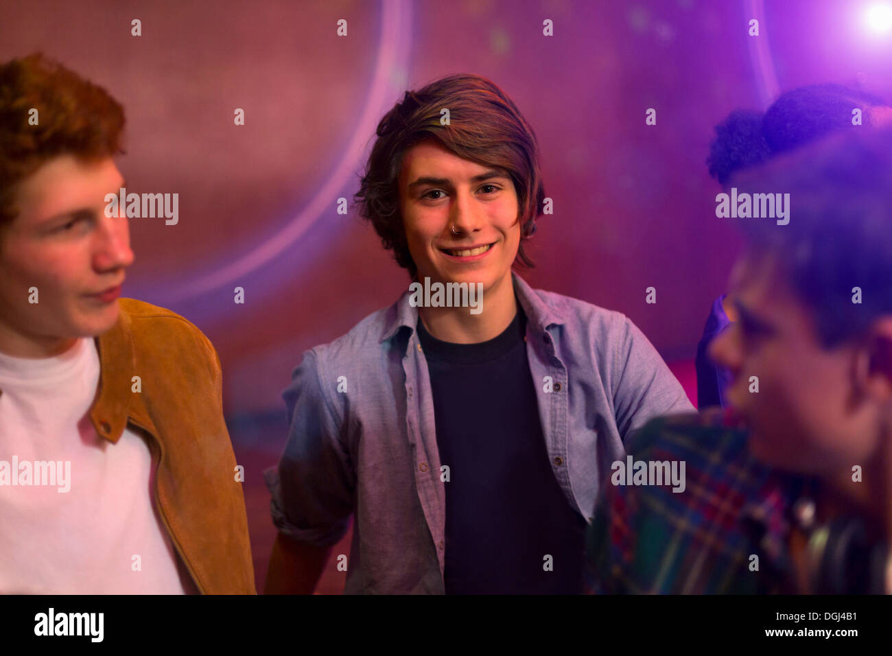 Teenage boys standing at party Stock Photo