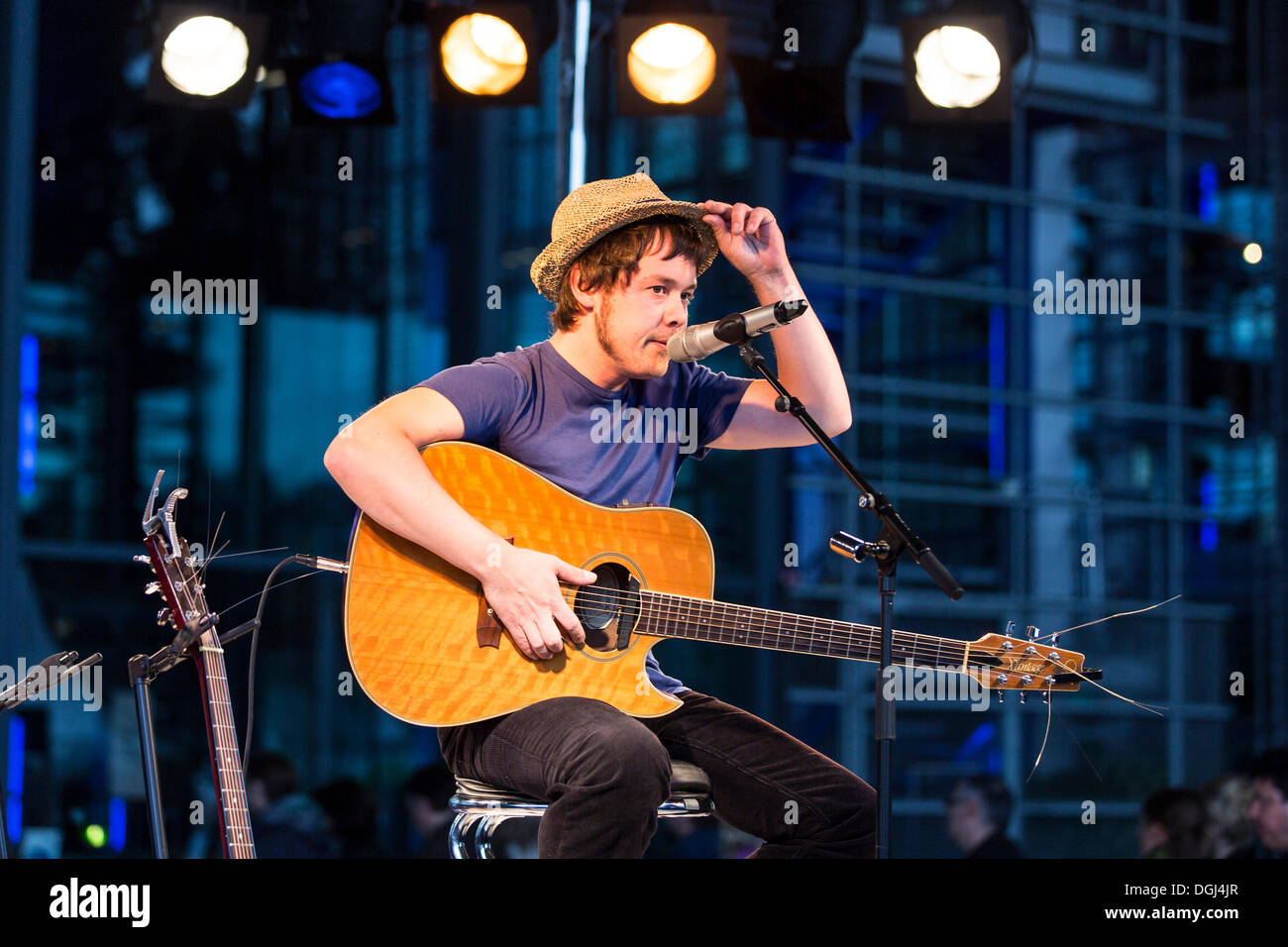 The British singer songwriter Jon Kenzie playing live outside KKL Plaza