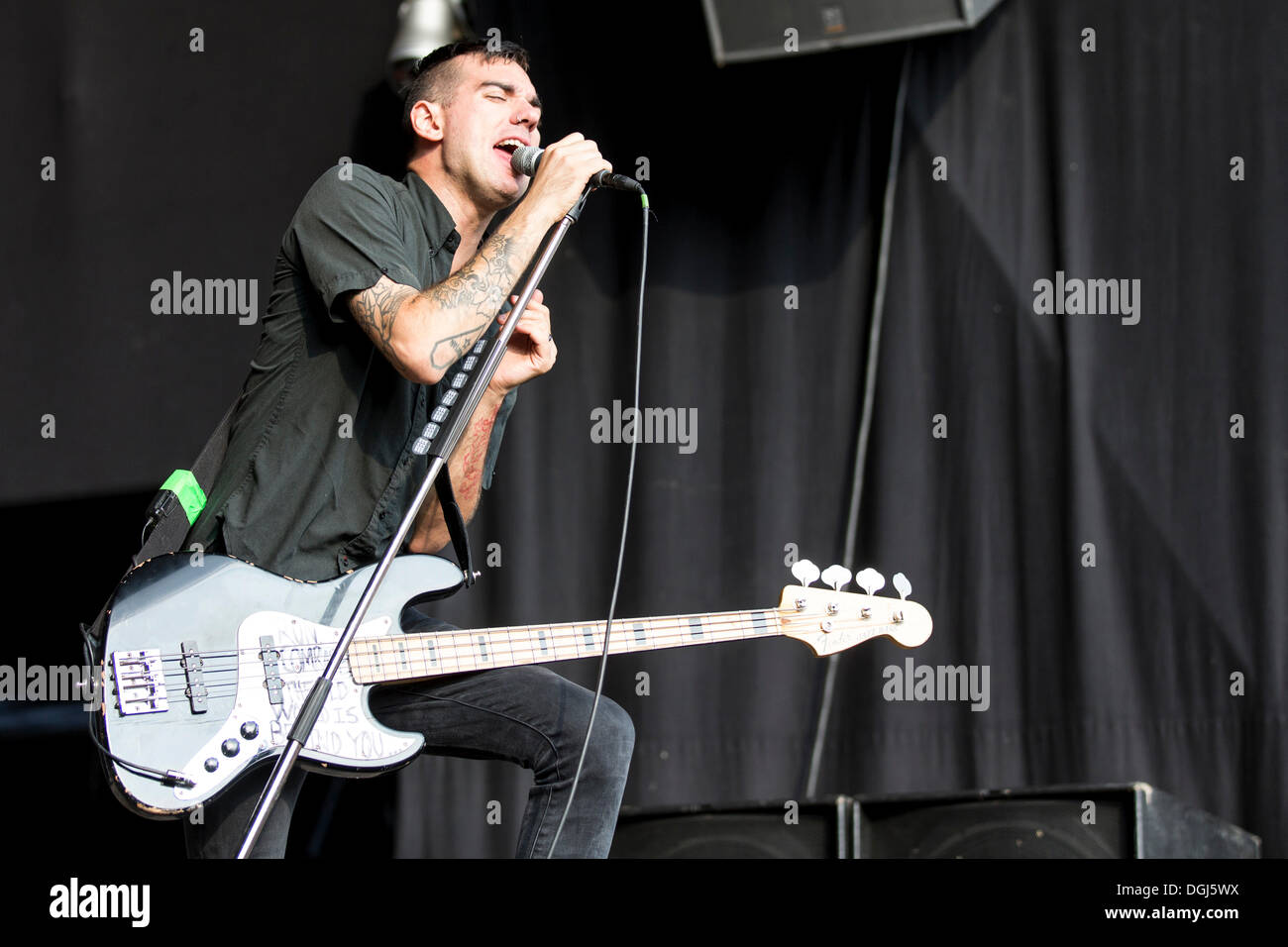 Bass player Chris Barker from the U.S. political punk band Anti-Flag performing live at Heitere Open Air in Zofingen, Aargau Stock Photo