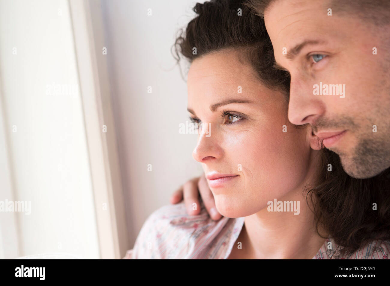 Close up profile of heterosexual couple Stock Photo
