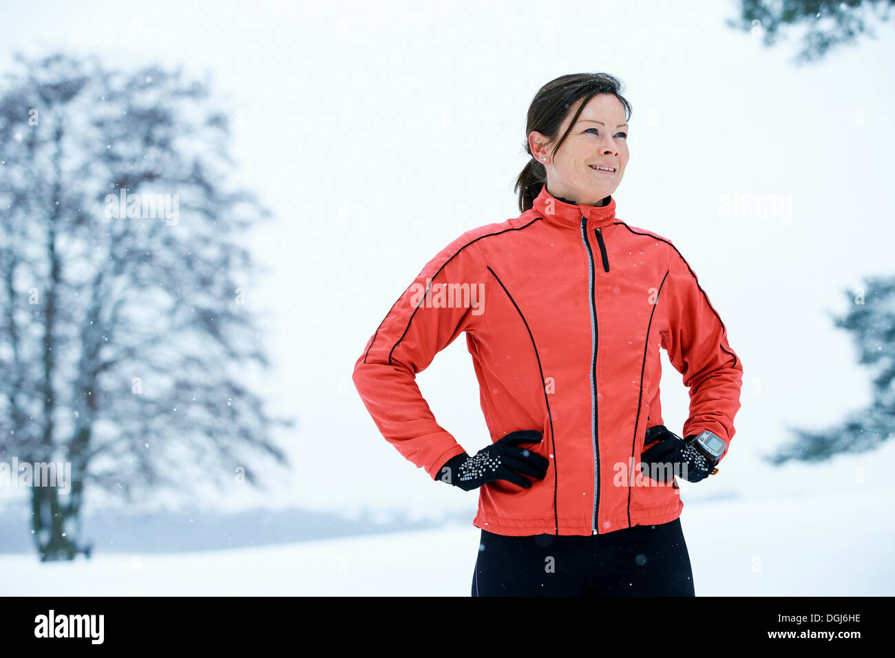 Close up of woman standing in snow field Stock Photo