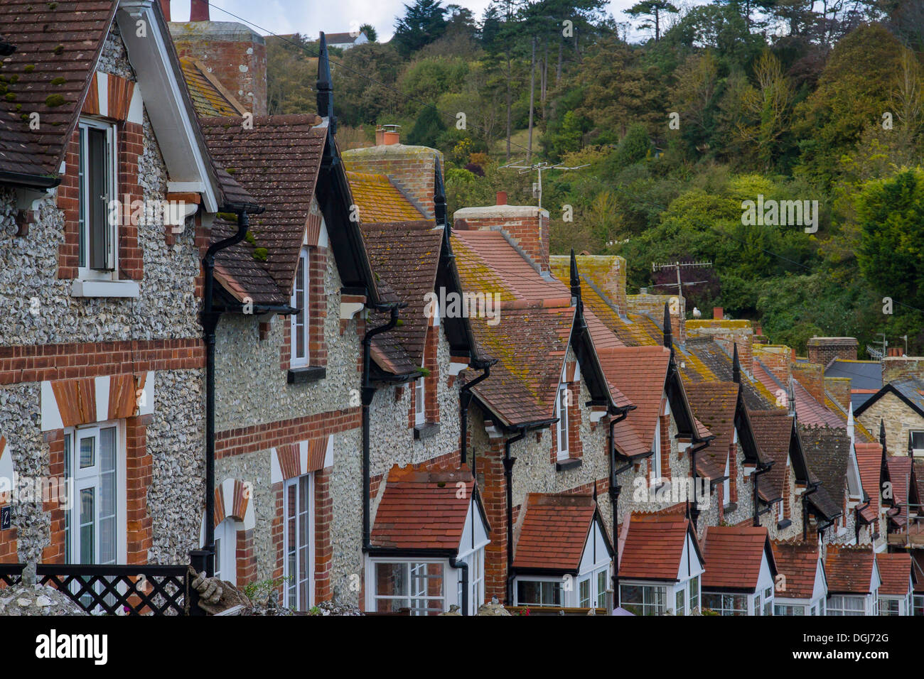 A terrace of gabled houses stepped down a steep hill. Stock Photo