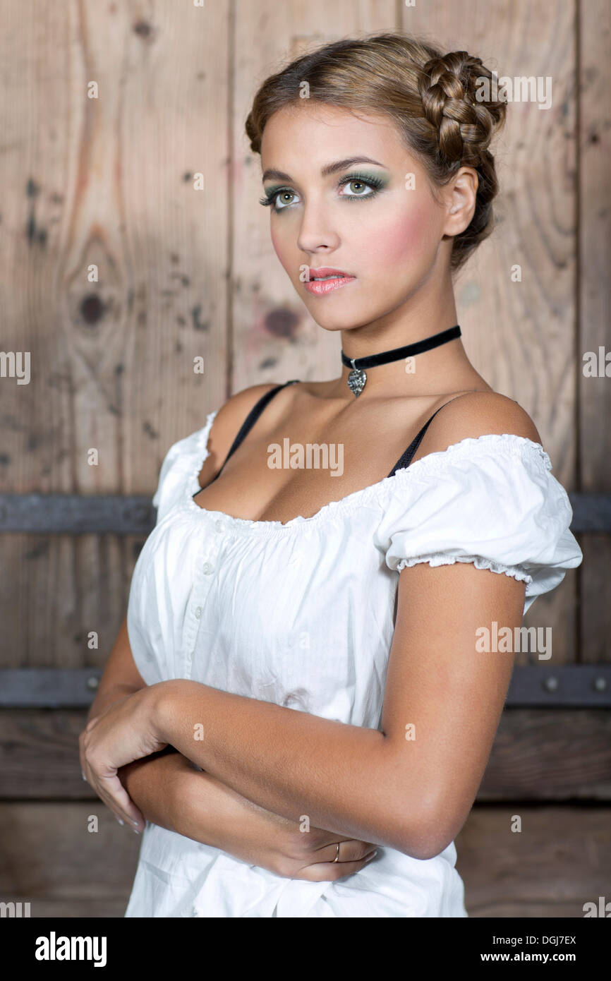 Young woman wearing a white dirndl top, portrait, dirndl look Stock Photo