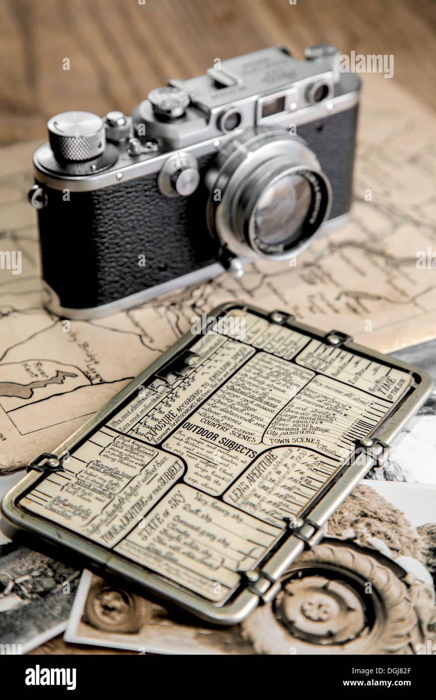 Kaufmann Posographe and a vintage Leica camera. Stock Photo