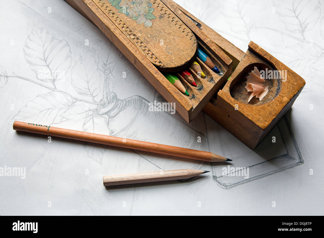 Handmade wooden pencil case and pencils. Stock Photo