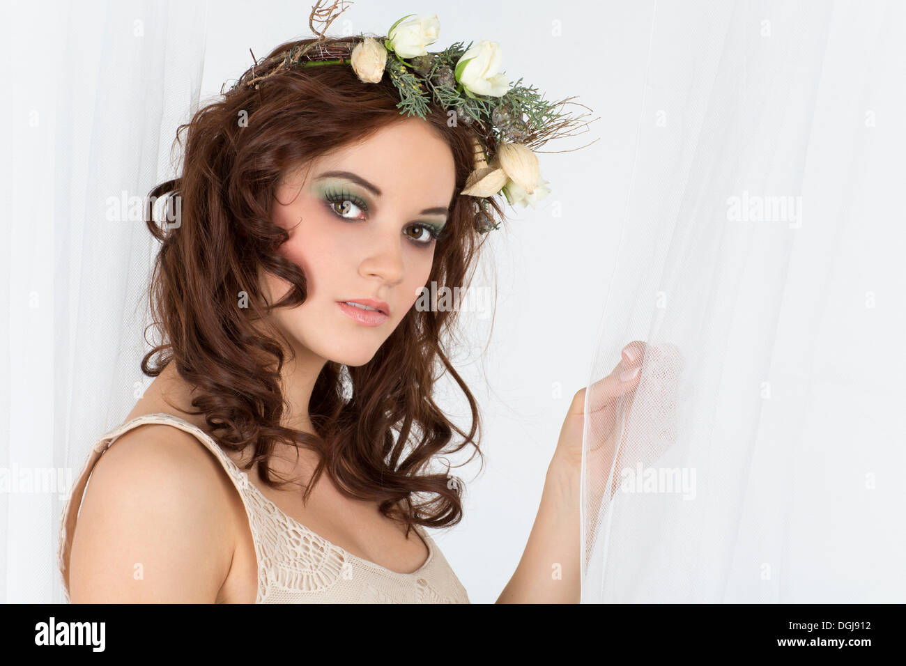 Young woman with a flower arrangement as a headdress Stock Photo