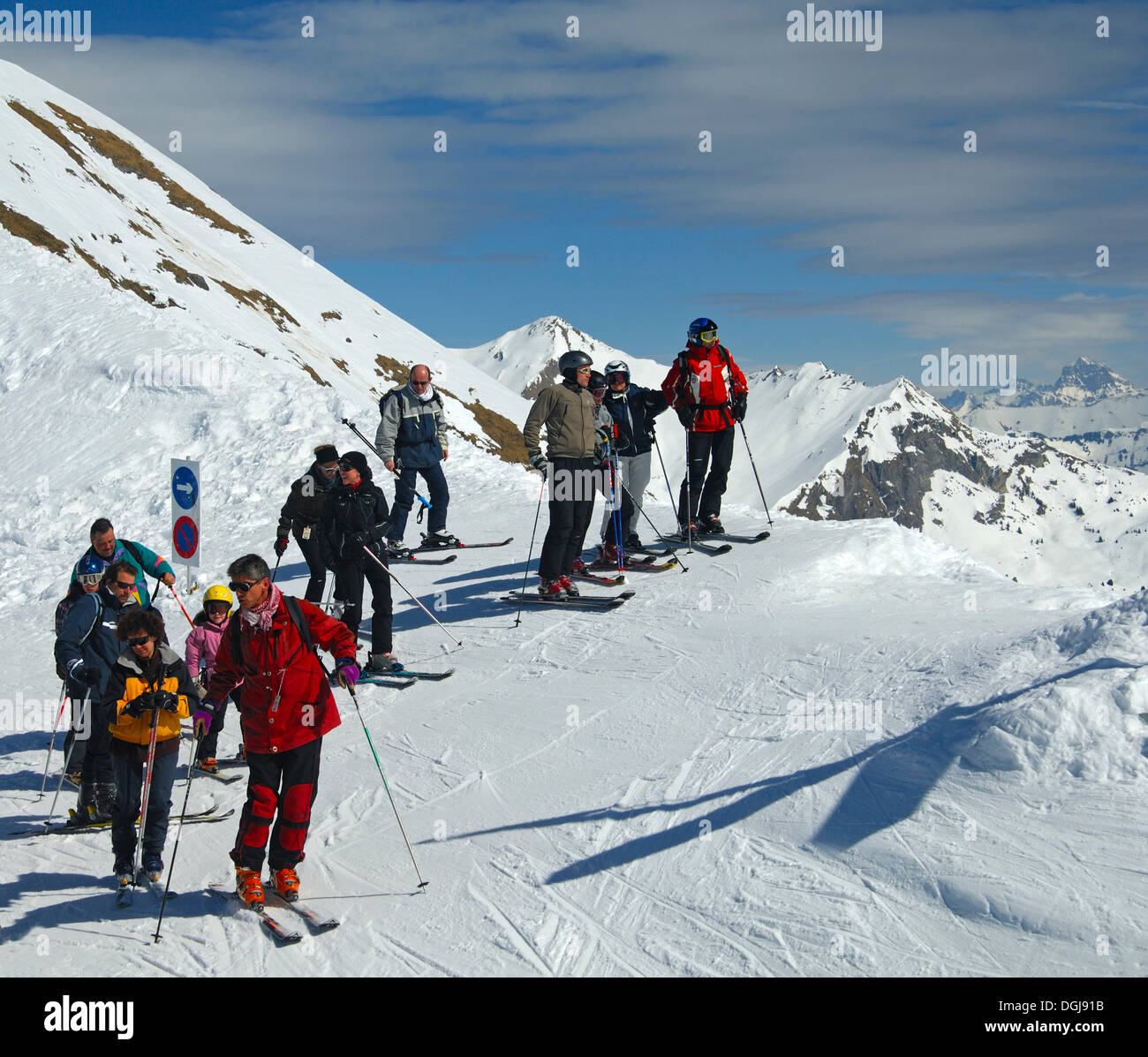 A group of skiers before decending in the high mountains, French Alps, Morzine, Savyoen, France, Europe Stock Photo