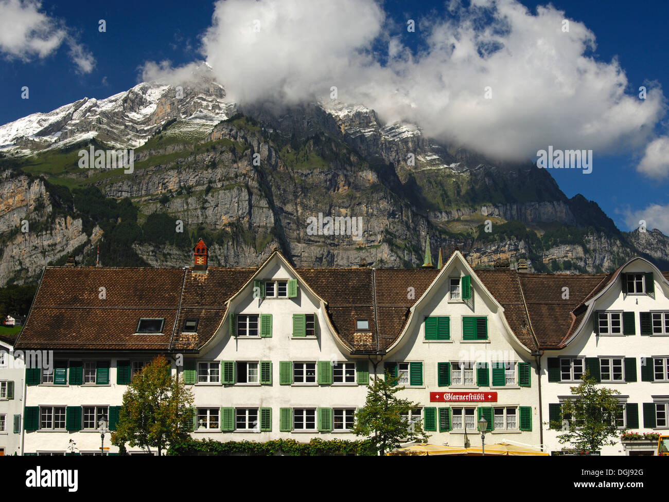 Row of houses in the Landsgemeindeplatz, town square, in front of the Glarus Alps, Glarus, Switzerland, Europe Stock Photo