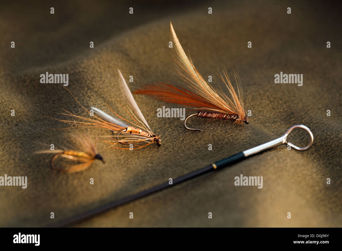 Hand tied fly fishing wet flies and rod. Stock Photo