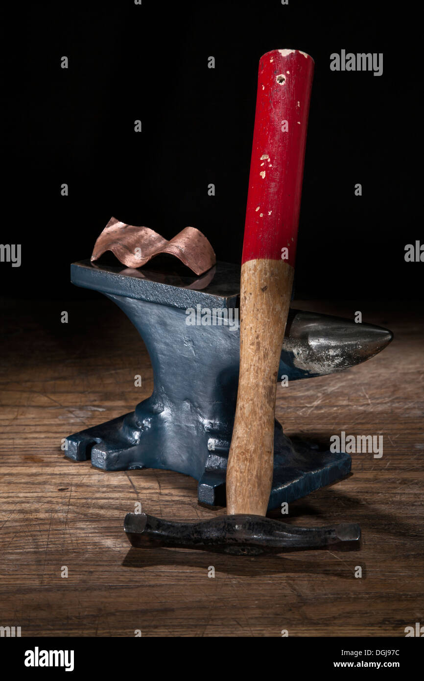 Metal forming tools and forged copper work. Stock Photo