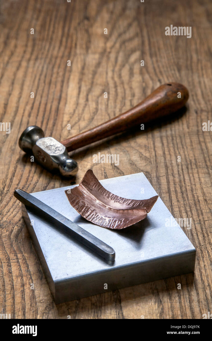 Metal chasing tools and copper chased work. Stock Photo