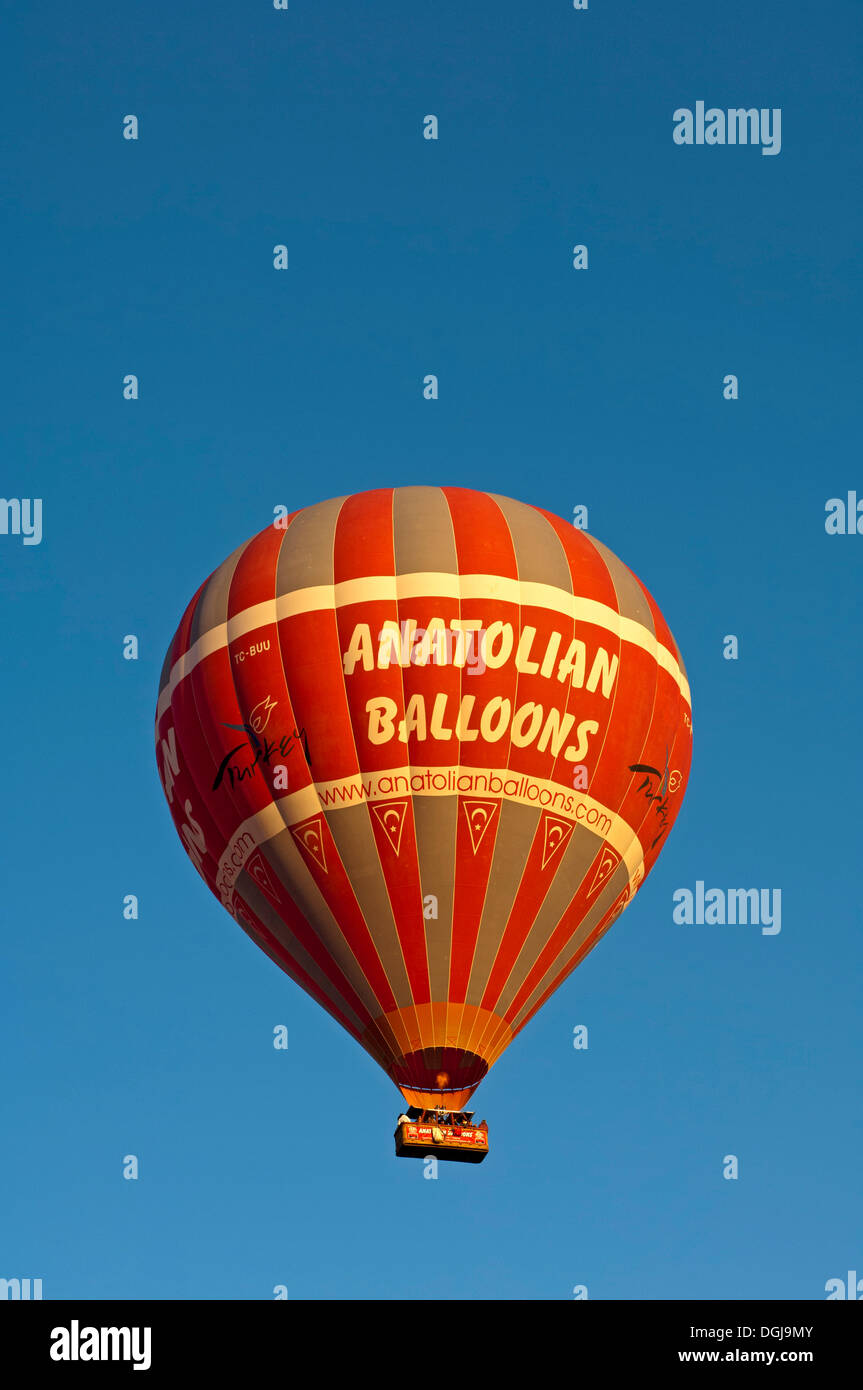 Ballooning in a hot-air balloon labelled Anatolian Balloons, Goreme, Turkey Stock Photo