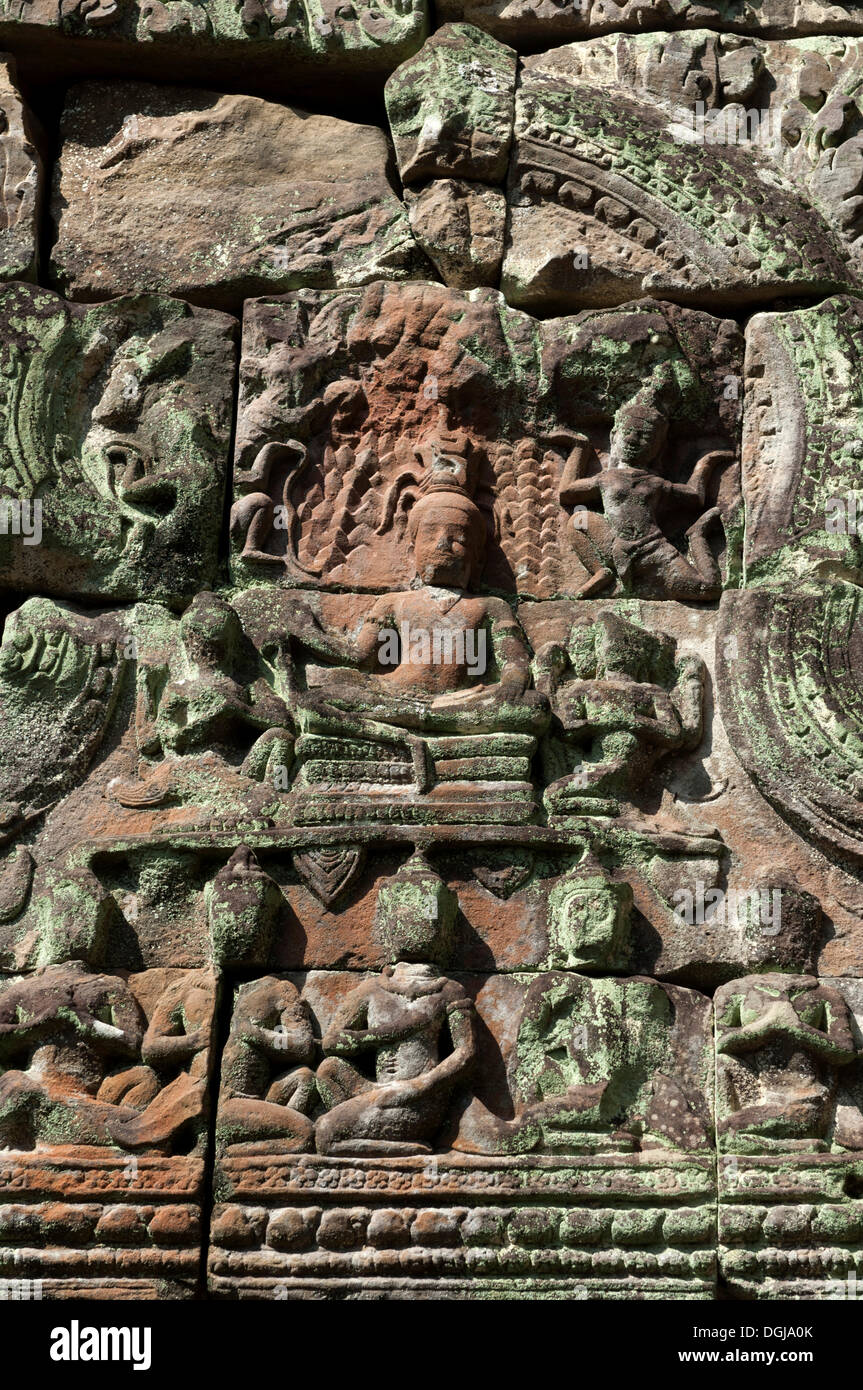 Bas-reliefs carved in sandstone, decoration, the bottom row of figures depicting Hindu believers, known as ascetics or Essaia, Stock Photo