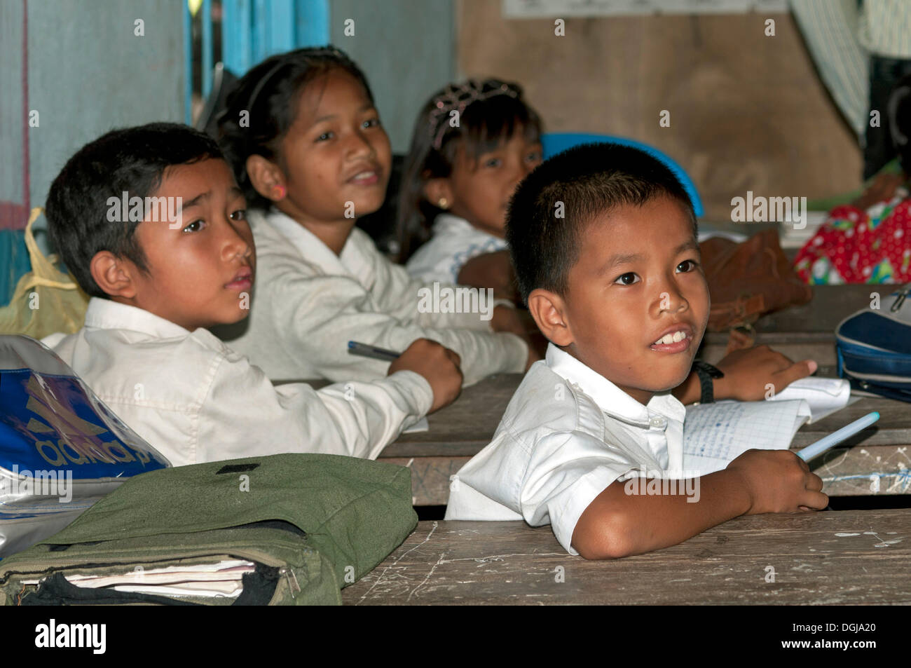 Elementary students wearing school uniforms in a school of Areyskat, a suburb of Phnom Penh, Cambodia, Southeast Asia Stock Photo