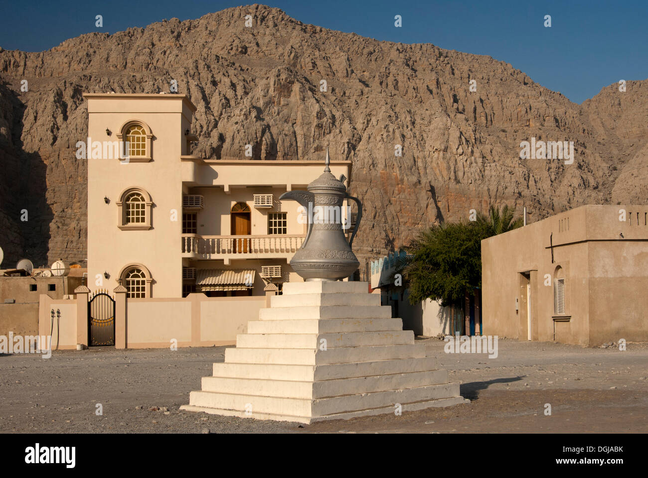 Scuplture of a traditional Arabian coffee pot as a symbol of Arab tradition and hospitality, Khasab, Musandam Governorate, Oman Stock Photo