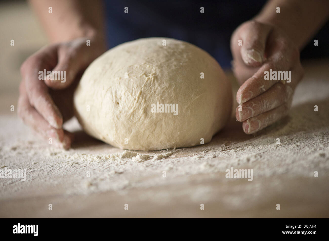 Close up of hands shaping bread dough Stock Photo Alamy