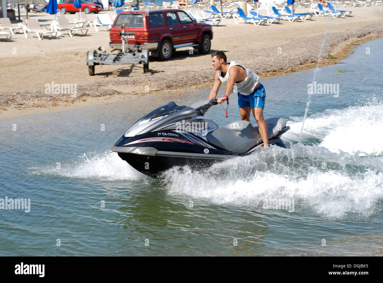 Young man riding a waterbike in Ibiza, Spain Stock Photo