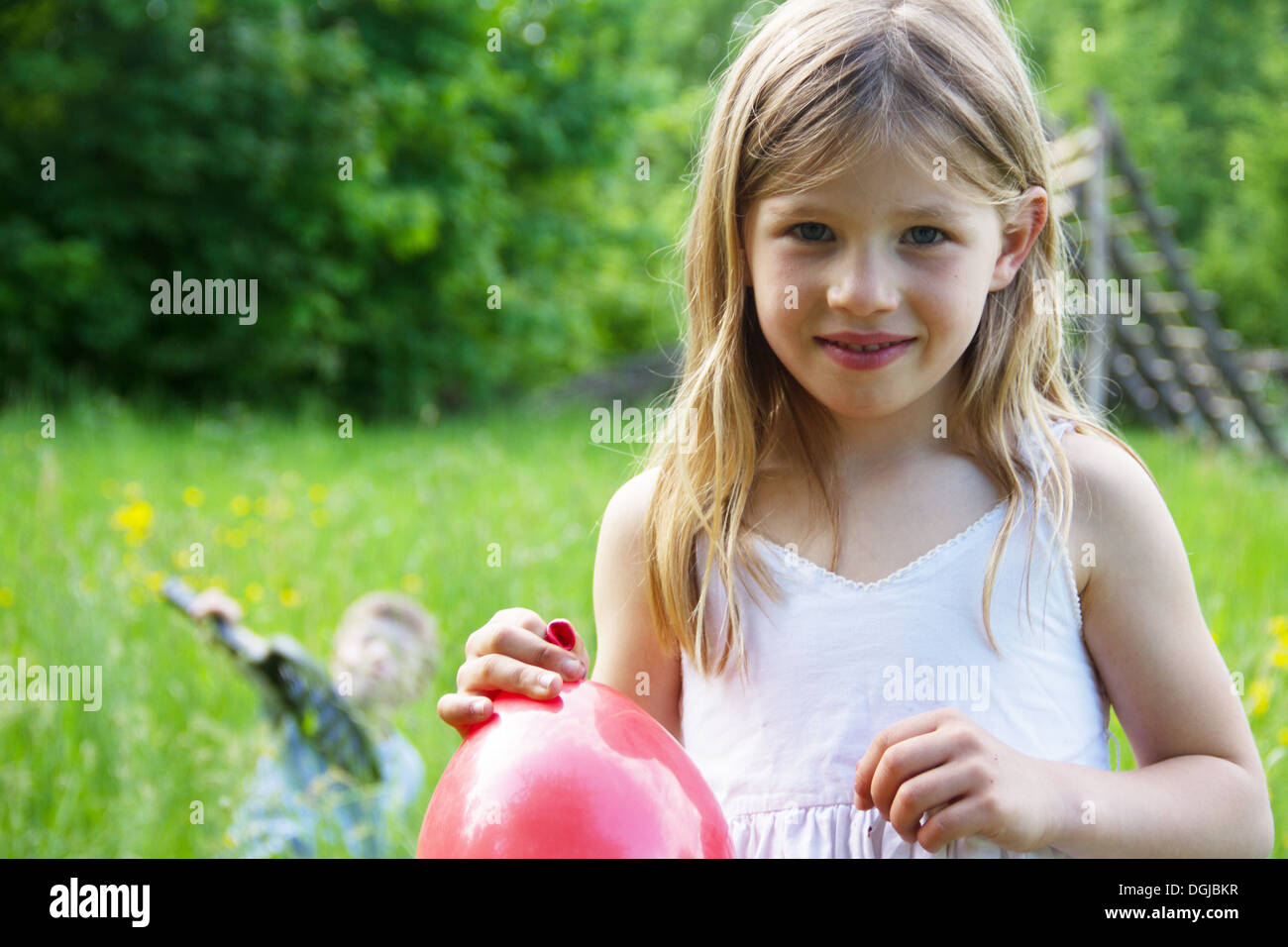 Girl holding green balloon hires stock photography and images Alamy