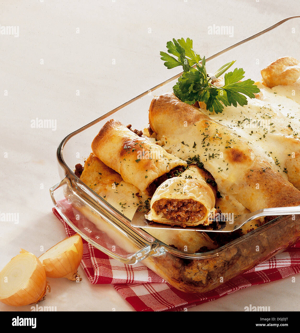 Baked pancakes, Palatschinken, with spicy minced beef, Hungary. Stock Photo
