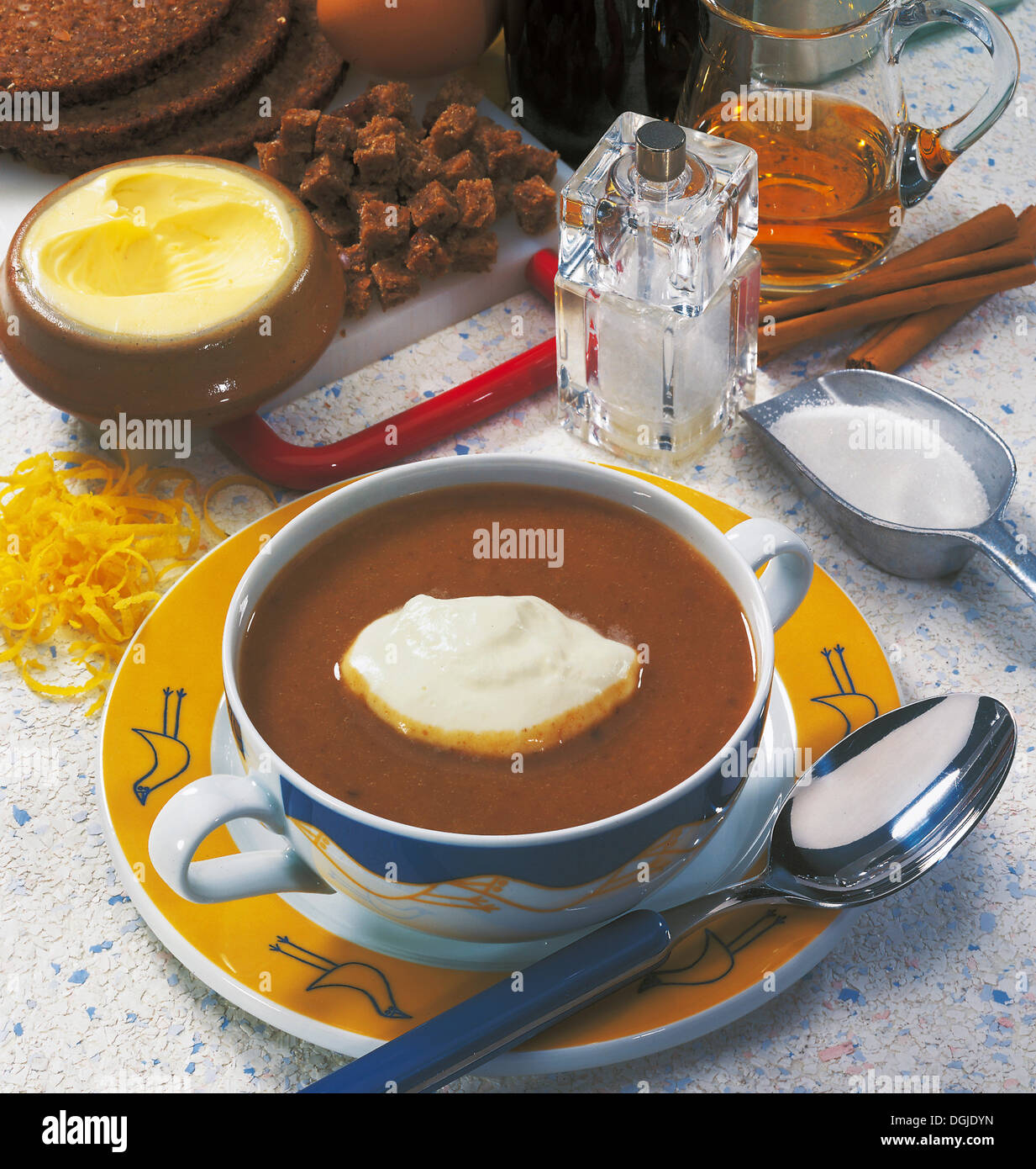 Danish beer and ginger soup with brown bread, malt beer, cream, Denmark. Stock Photo
