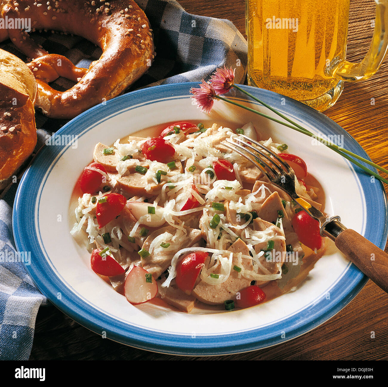 Bavarian sausage salad with radish, mild pork sausage and radish, delicious salads, Germany. Stock Photo