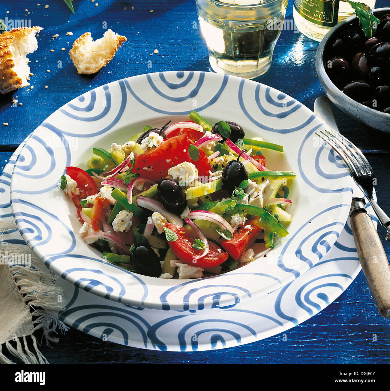 Greek salad, with cucumber, peppers, tomatoes, red onion, black olives and feta cheese, Greece. Stock Photo