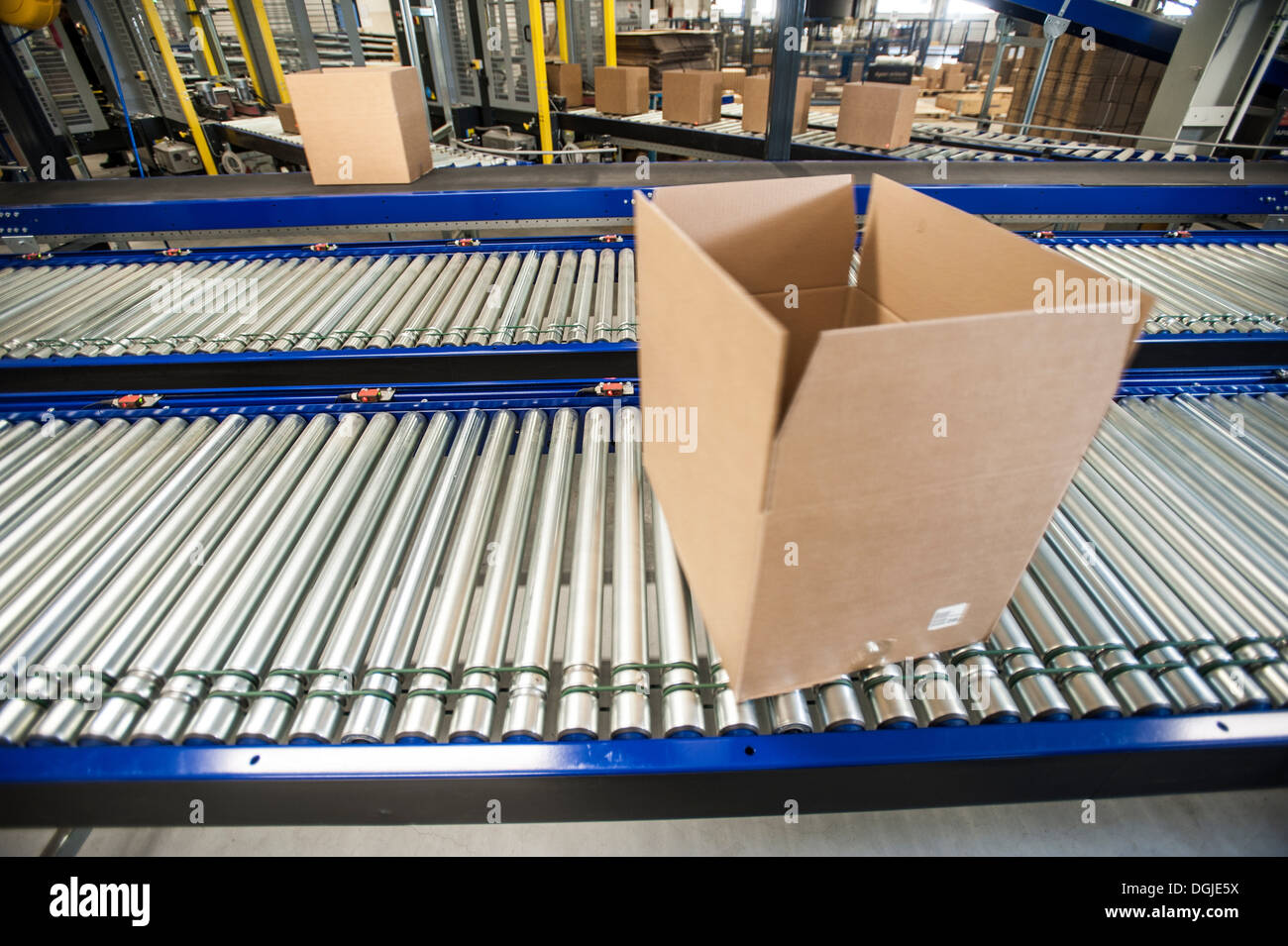 Empty box on moving conveyor belt Stock Photo