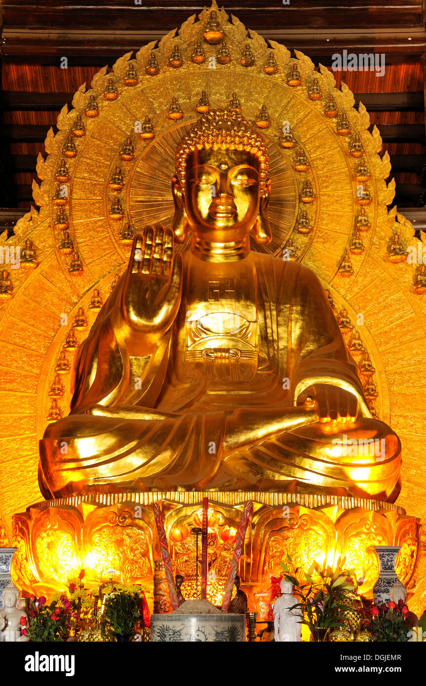 Buddha statue, the largest and heaviest bronze statue in Vietnam inside the Chua Bai Dinh pagoda, currently a construction site, Stock Photo