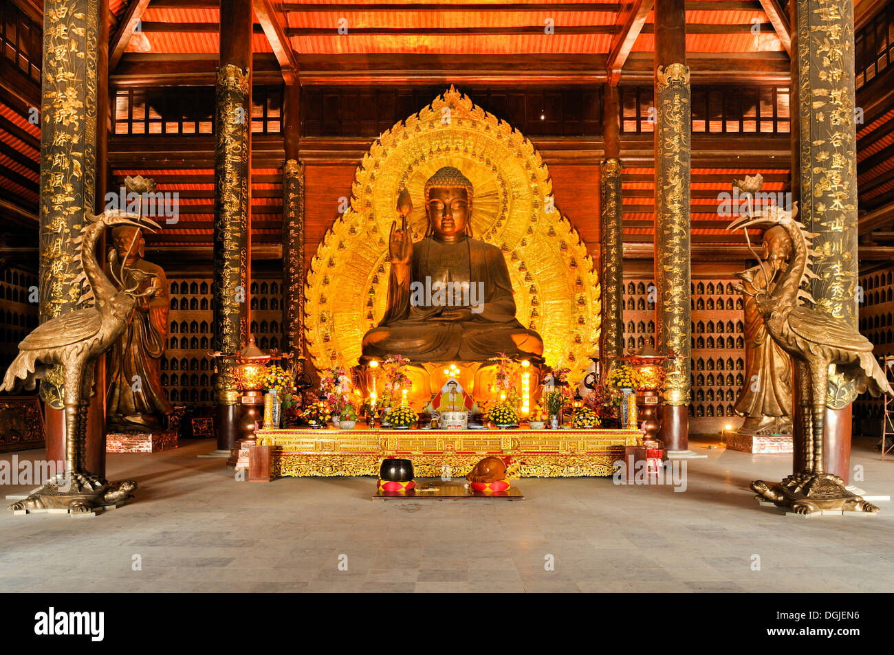 Golden Buddha statue at the construction site of the Chua Bai Dinh pagoda, one of the largest pagodas in Southeast Asia Stock Photo