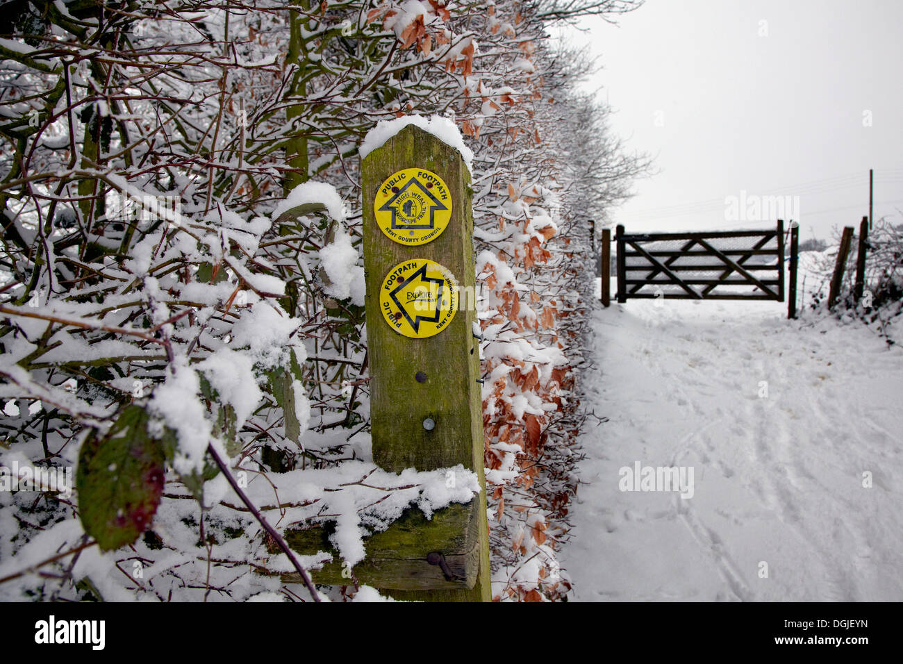 Footpath sign in snow. Stock Photo