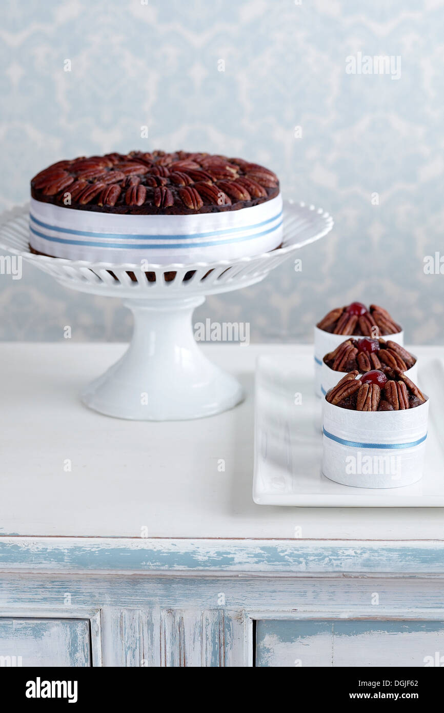 Fruitcake made with alcohol on cake stand Stock Photo