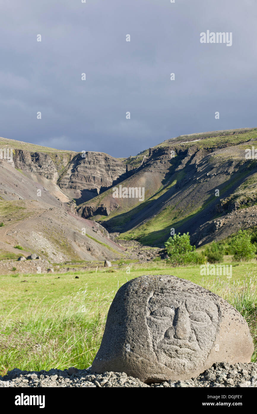 Stone sculpture by Páll Guðmundsson, Bæjarfell Gorge at back, Húsafell, Iceland, Europe Stock Photo