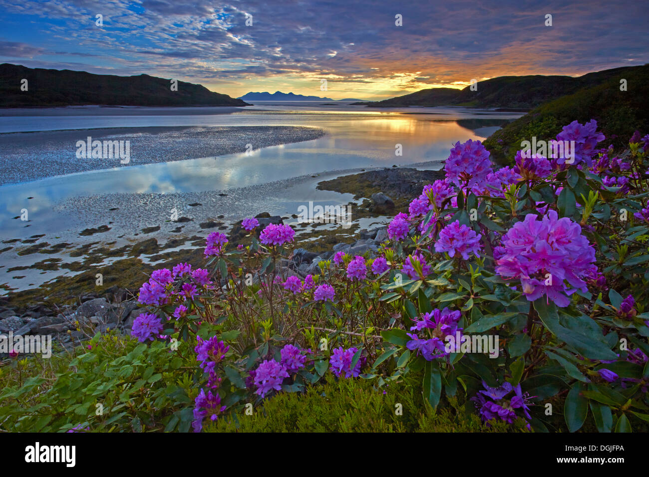 Sunset over Morar Sands looking towards with the islands of Eigg and Rhum. Stock Photo