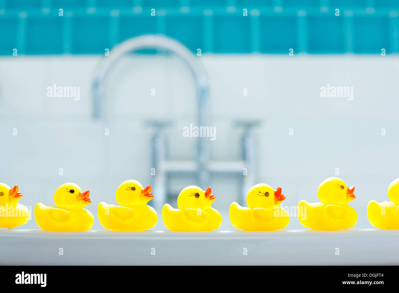 Row of three yellow rubber ducks for bathtime Stock Photo