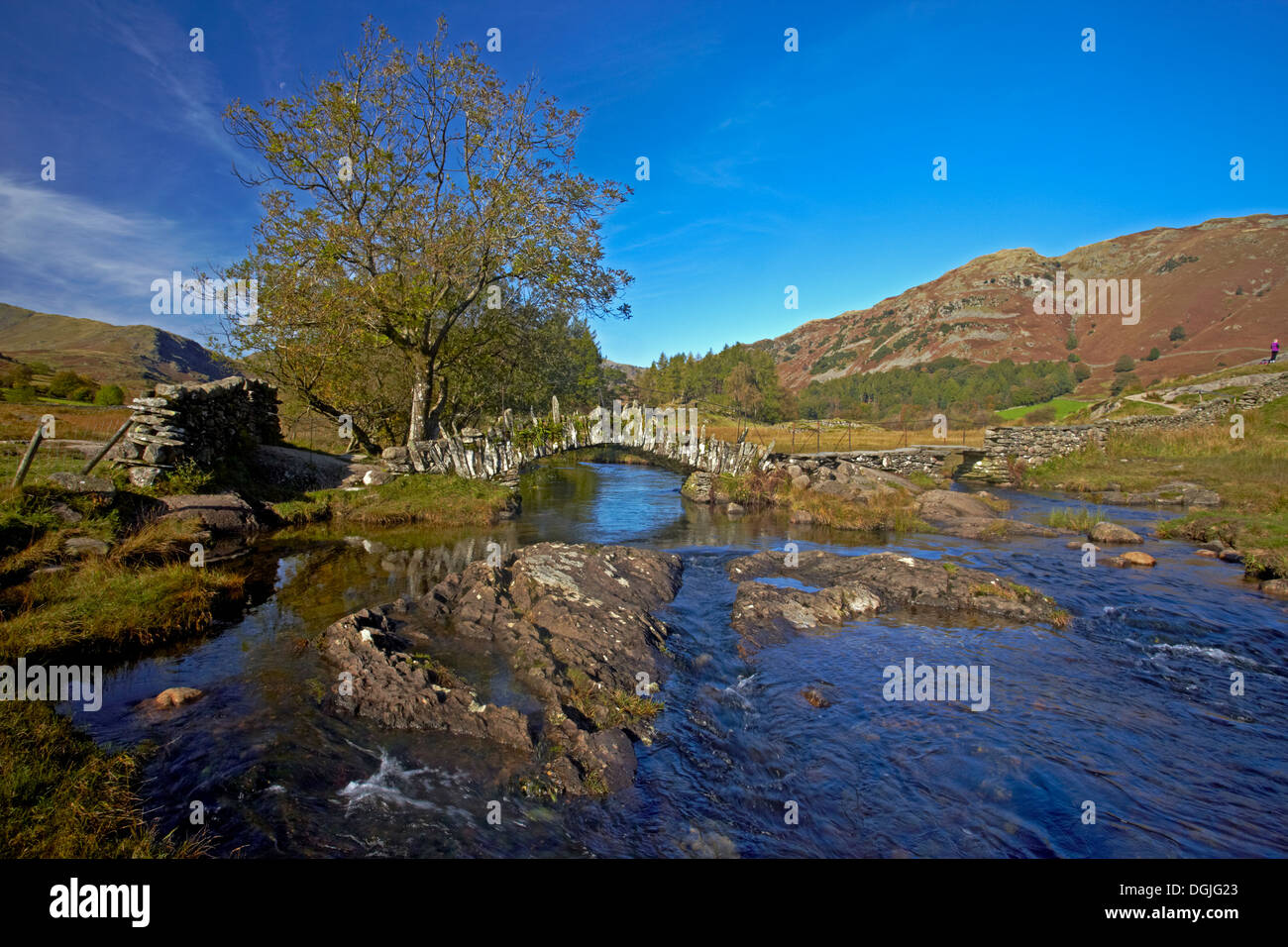 A view of Slater Bridge which crosses the River Brathay on its way from Little Langdale Tarn to Elterwater. Stock Photo