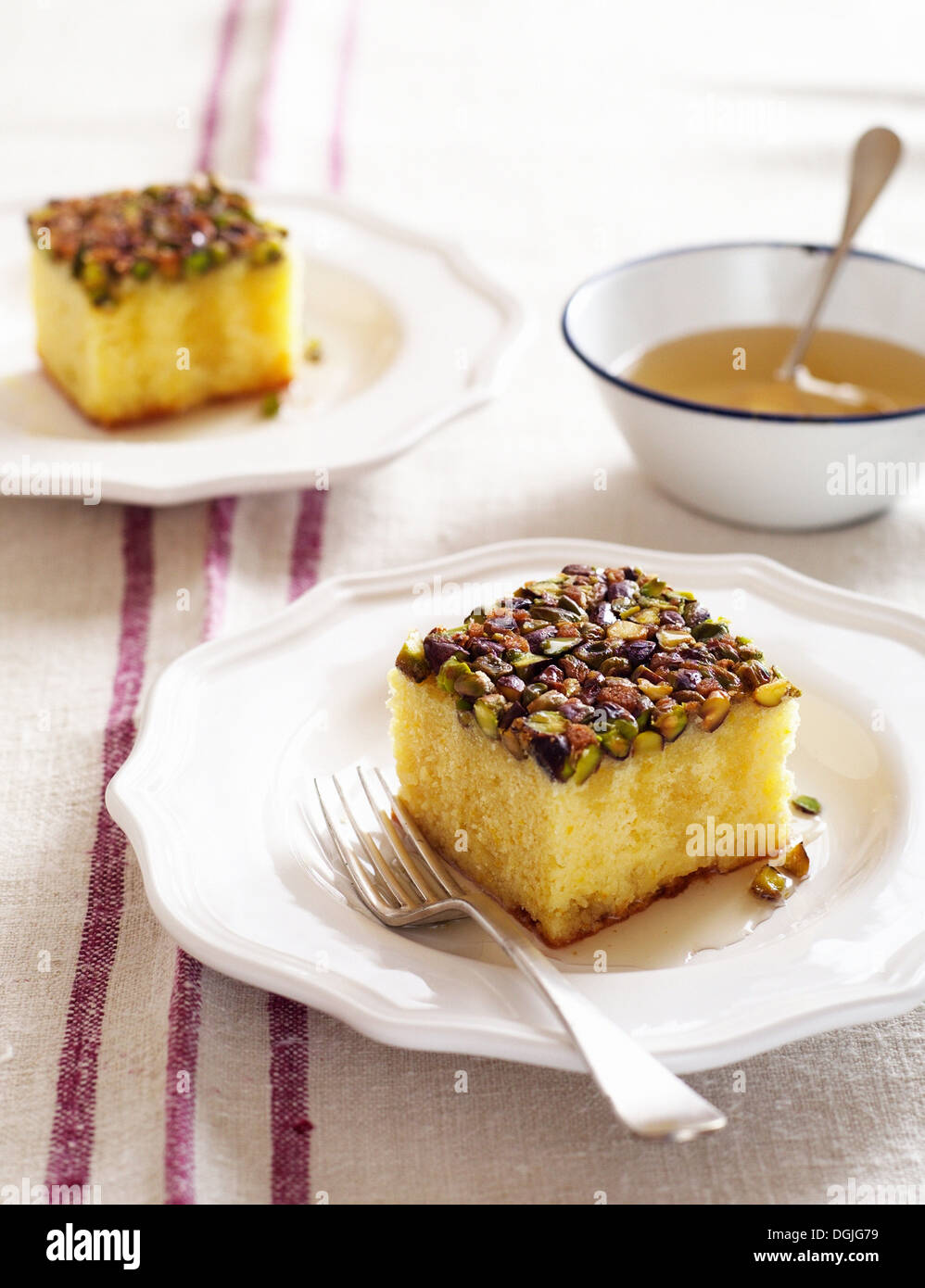 Lemon syrup cake with pistachios Stock Photo Alamy