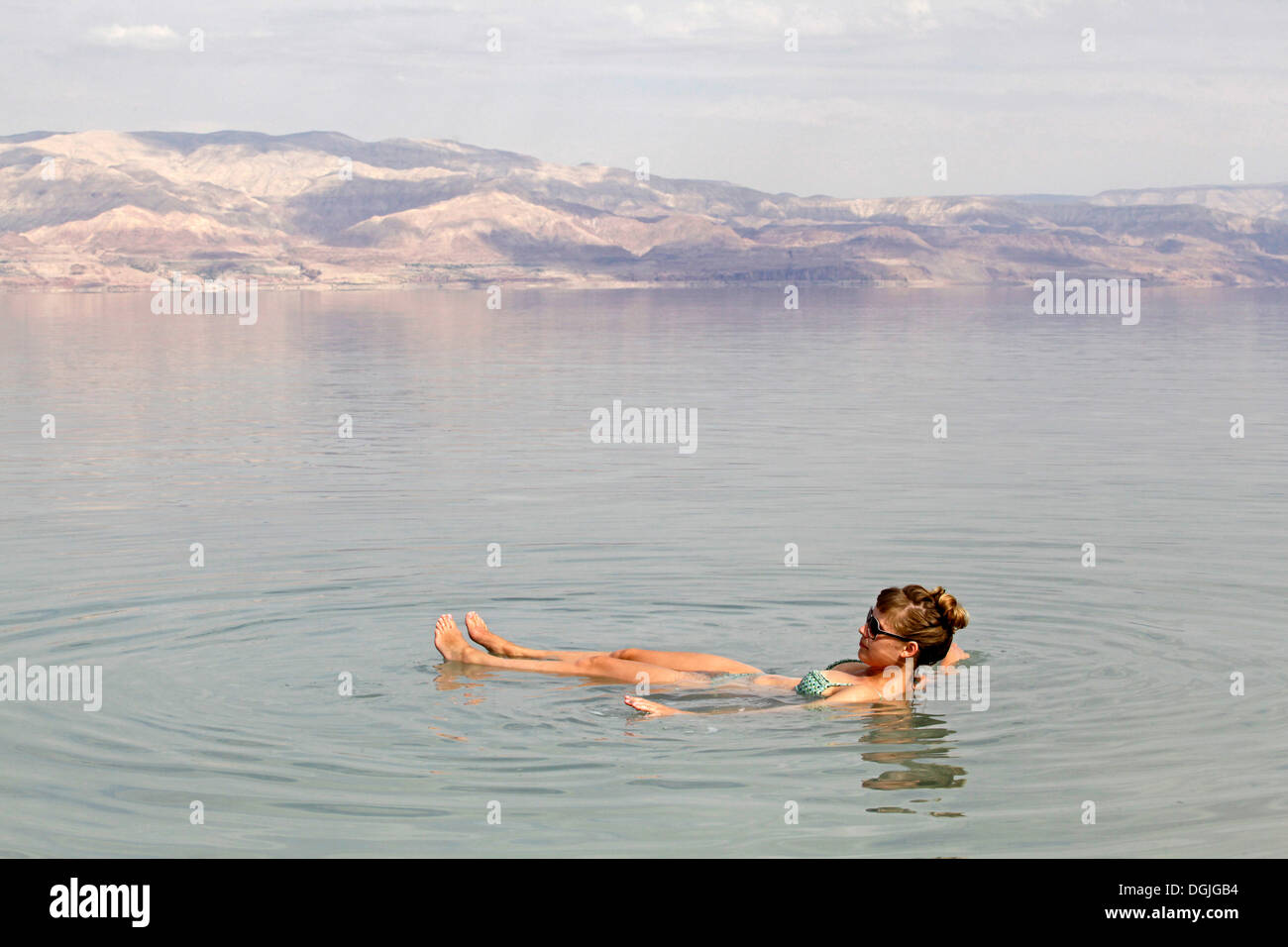 Young woman in the Dead Sea, West Bank, Israel, Middle East Stock Photo