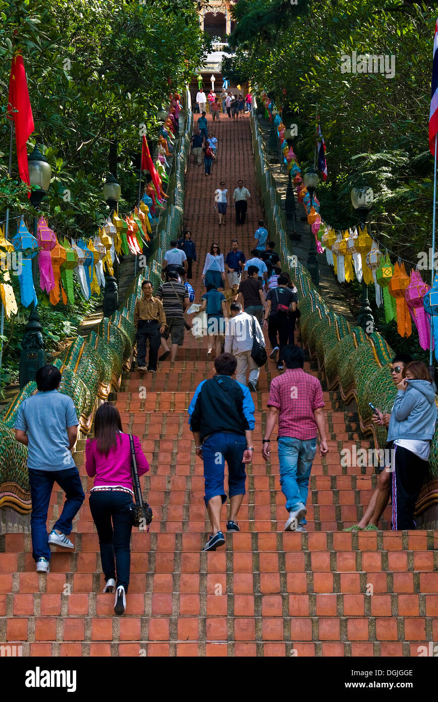 People climbing and descending the 300 steps up to Wat Phra That Doi
