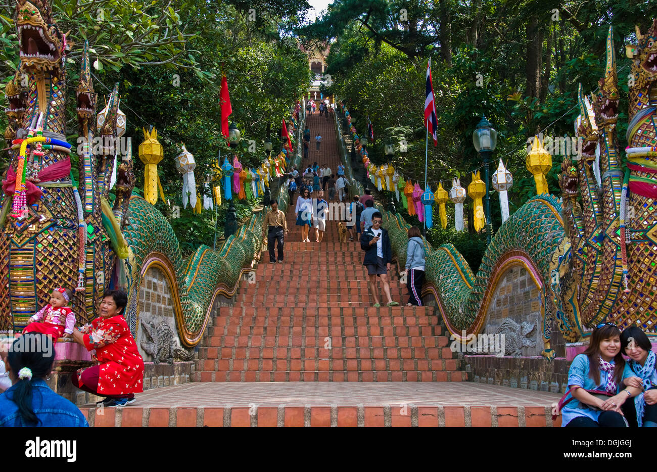 People climbing and descending the 300 steps up to Wat Phra That Doi