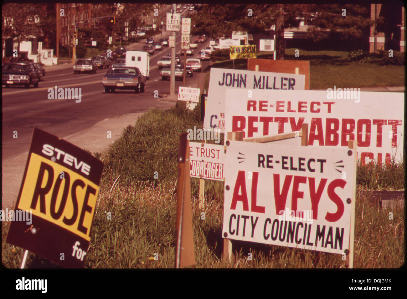 This image features political signs displayed along Dodge Street, one ...