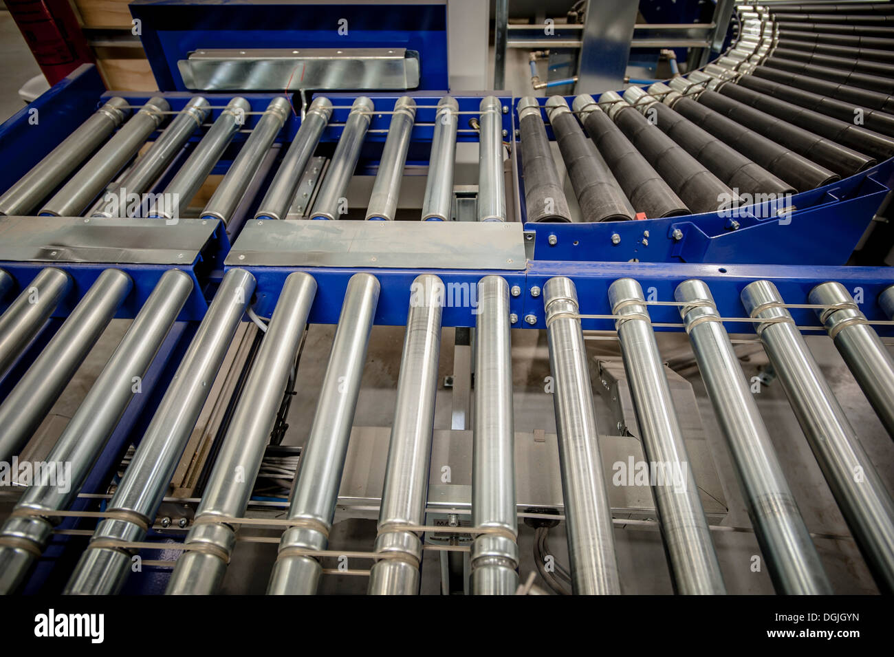 Empty conveyer belt in distribution warehouse Stock Photo