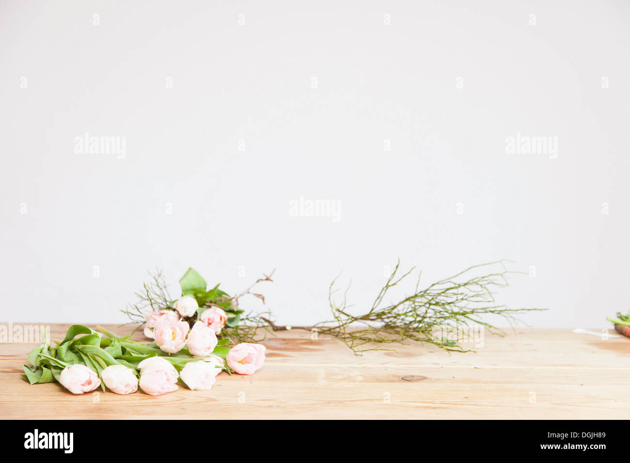 Pink roses to be arranged in florists Stock Photo