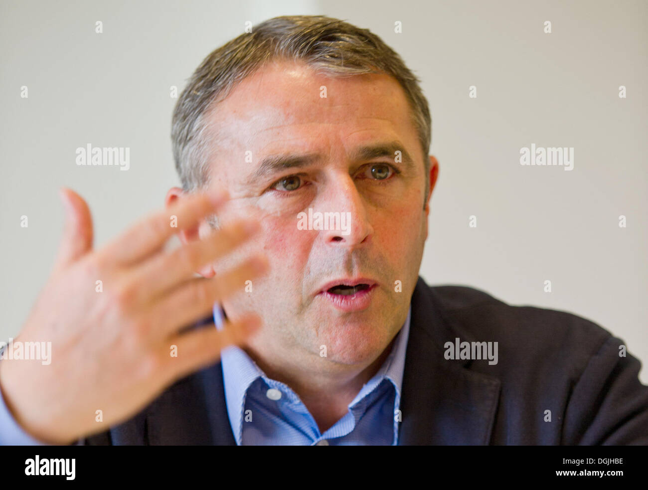Wolfsburg, Germany. 17th Oct, 2013. Manager of Bundesliga team VfL Wolfsburg Klaus Allofs sits during an interview with the dpa at Volkswagen Arena in Wolfsburg, Germany, 17 October 2013. Photo: Christoph Schmidt/dpa/Alamy Live News Stock Photo