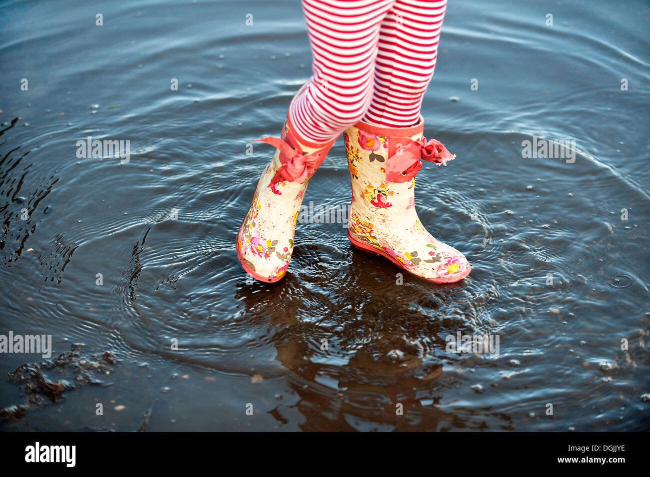 A child wearing colourful wellington boots Stock Photo - Alamy
