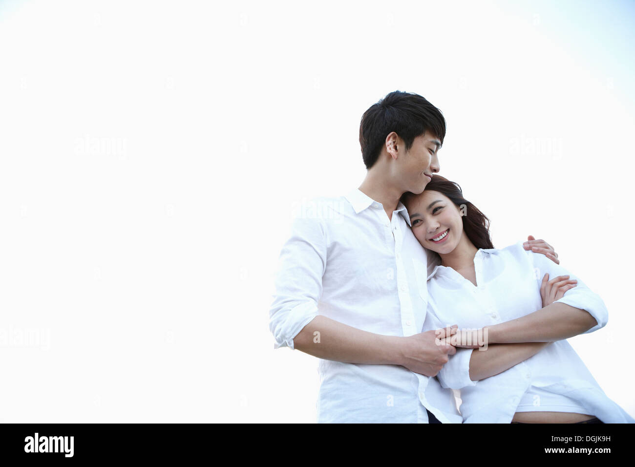 Couple hug arms hi-res stock photography and images - Alamy