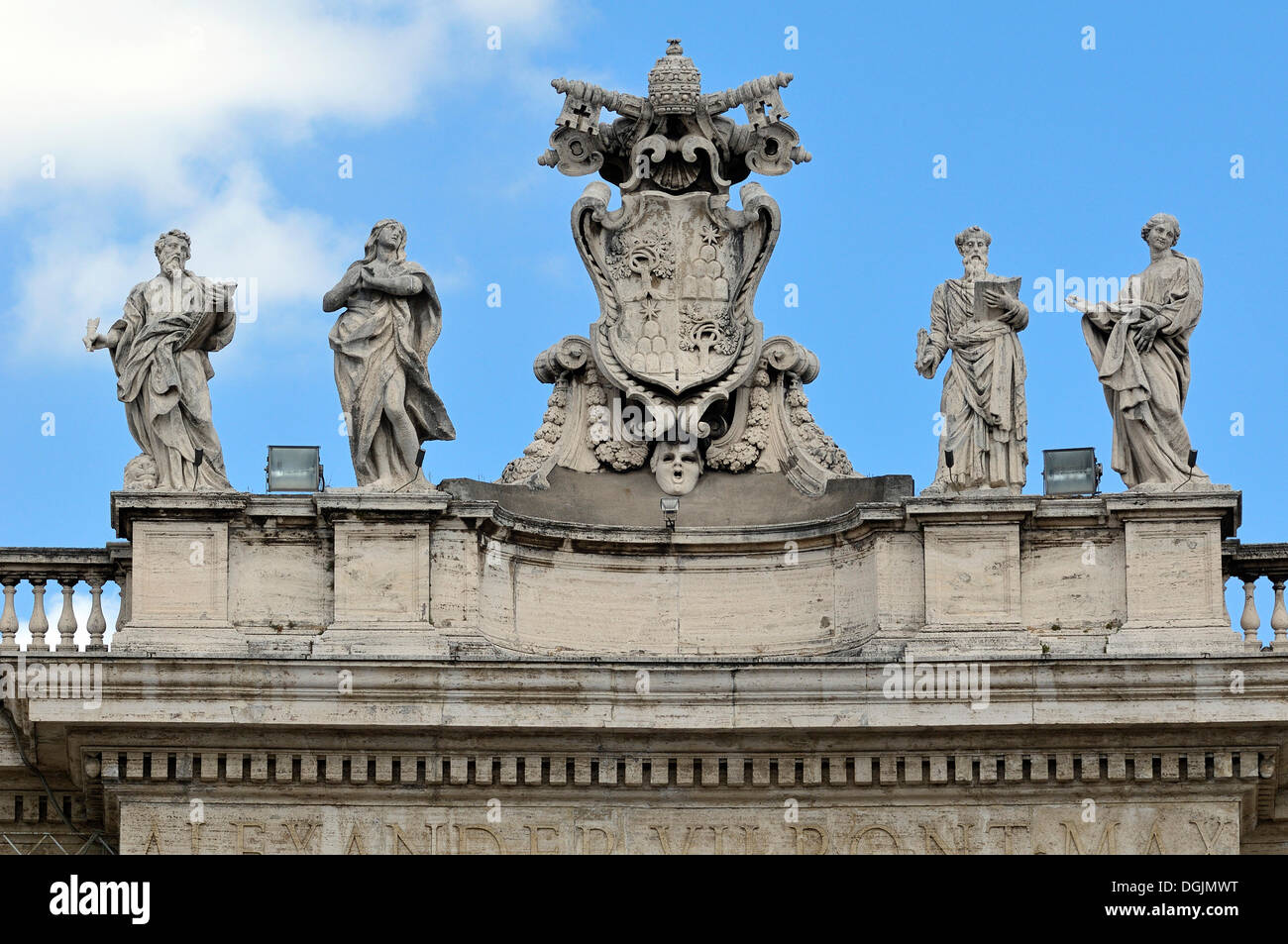 Pope's insignia between four statues of saints on the colonnades, St. Peter's Square, Vatican City, Rome, Latium region, Italy Stock Photo