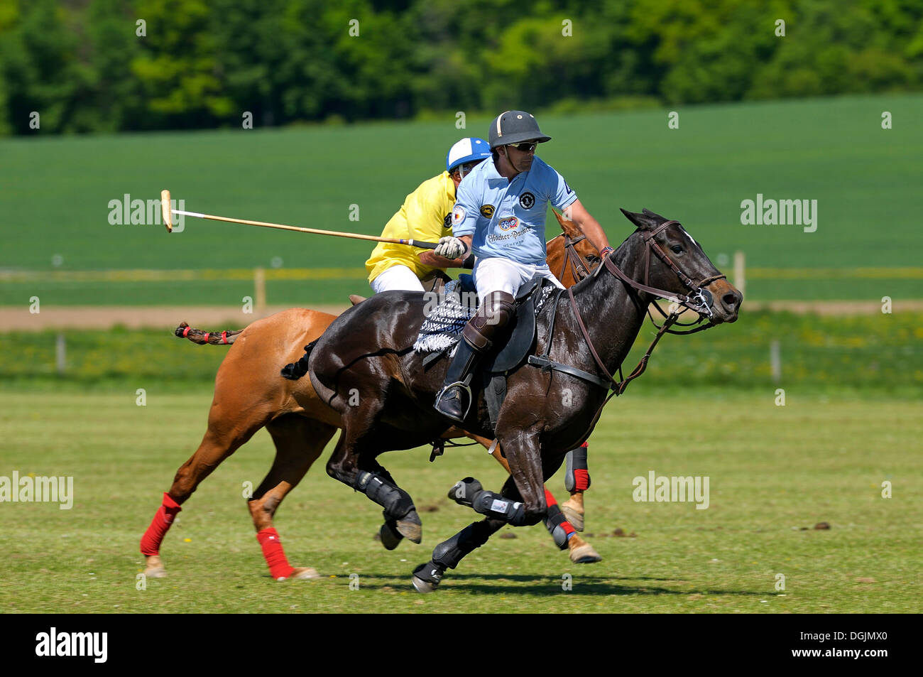 Edgardo Phagouape, a Team Hacker-Pschorr polo player being chased by an opposing player wearing a yellow jersey Stock Photo