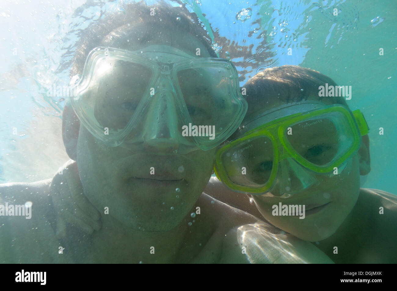 Father and son wearing diving goggles underwater, Vassiliki, Lefkas or Lefkada, Greece, Europe Stock Photo